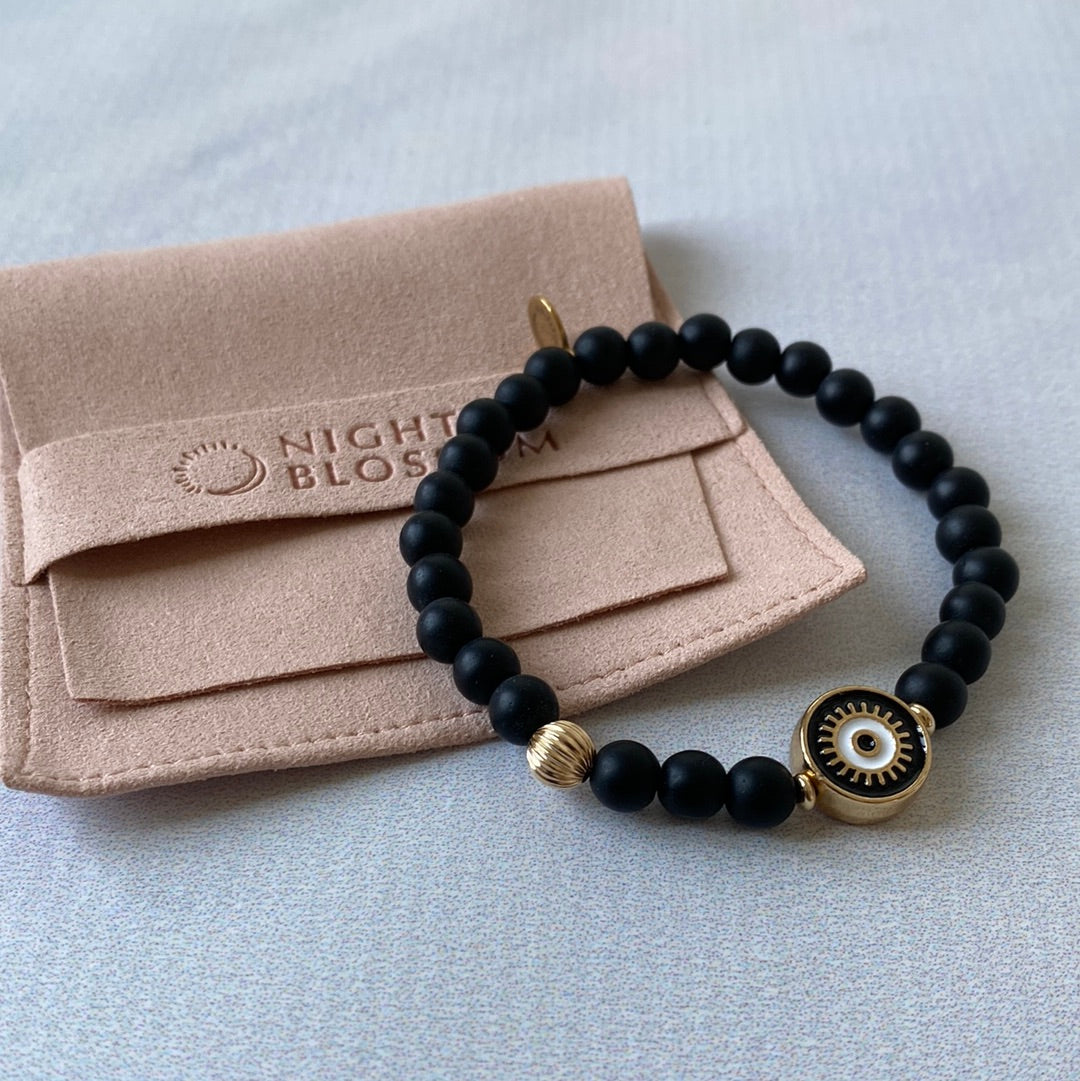 Black eye bracelet with gold accent