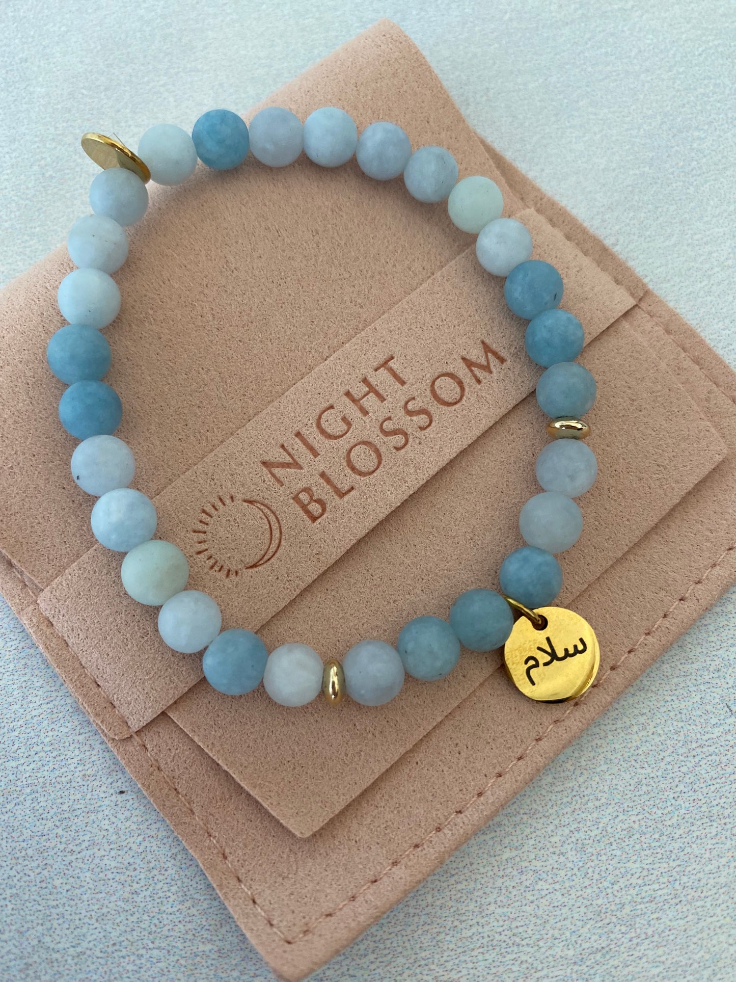 Aquamarine Arabic word bracelets