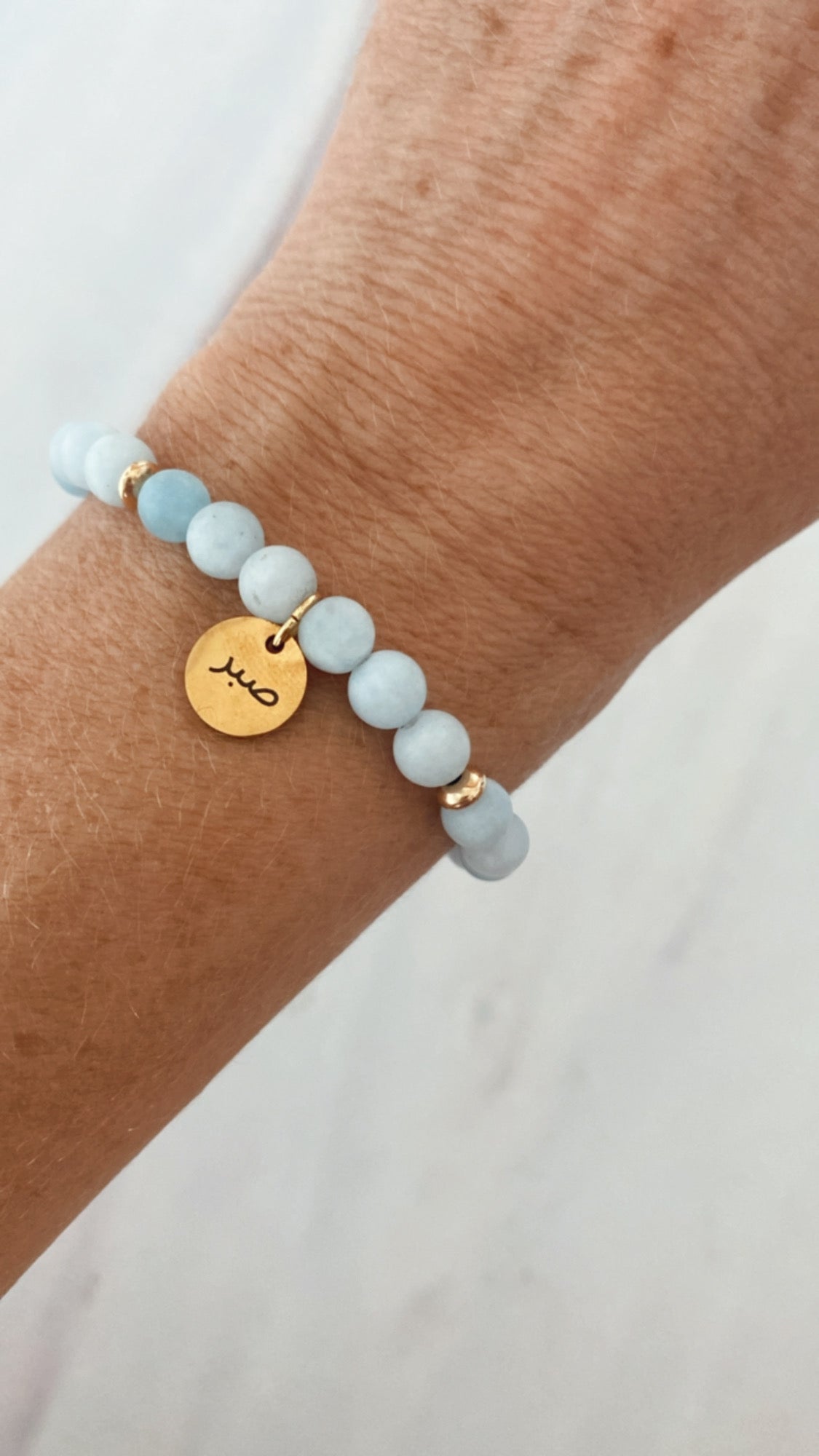 Aquamarine Arabic word bracelets