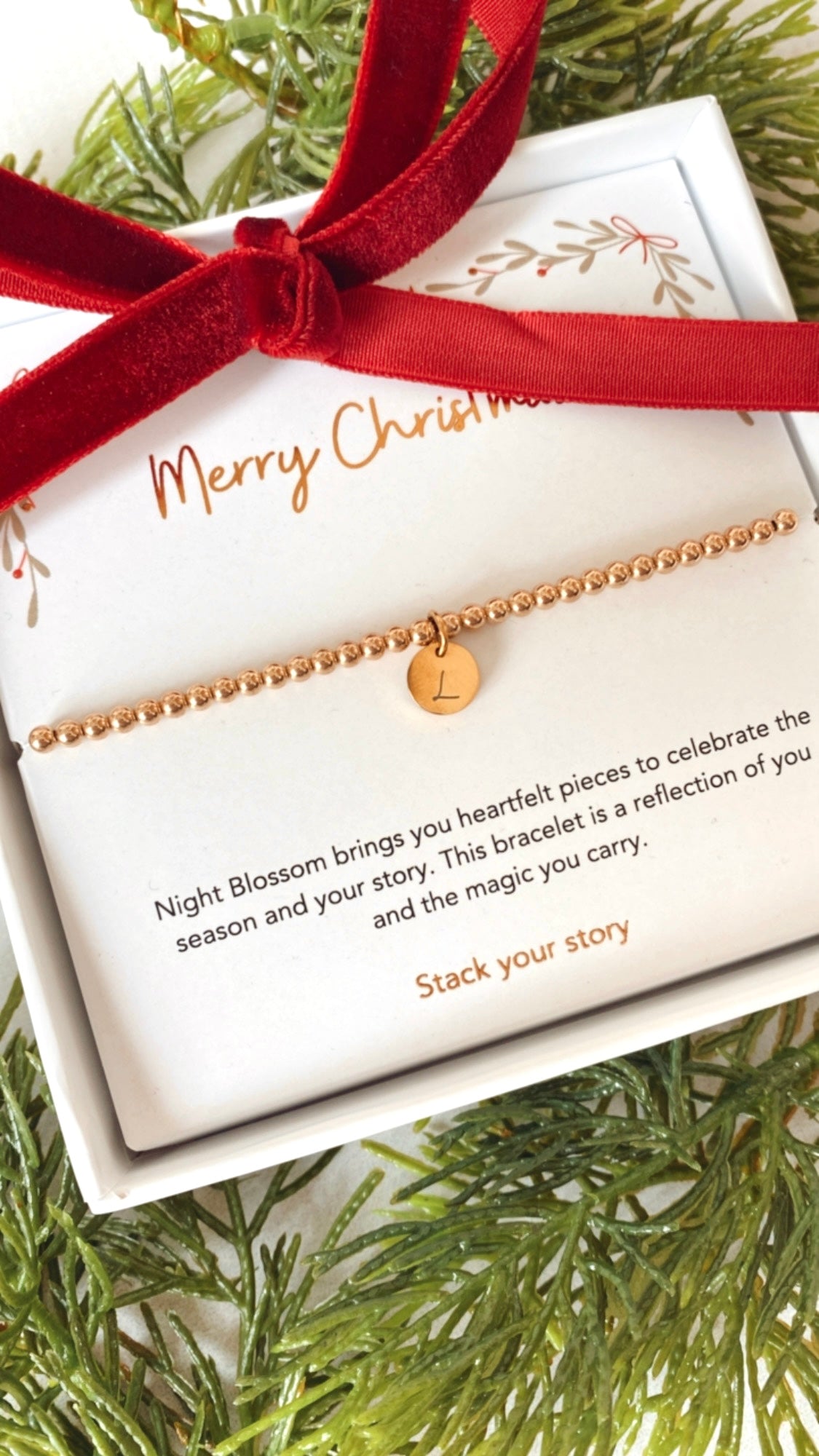 Festive gold initial charm bracelet