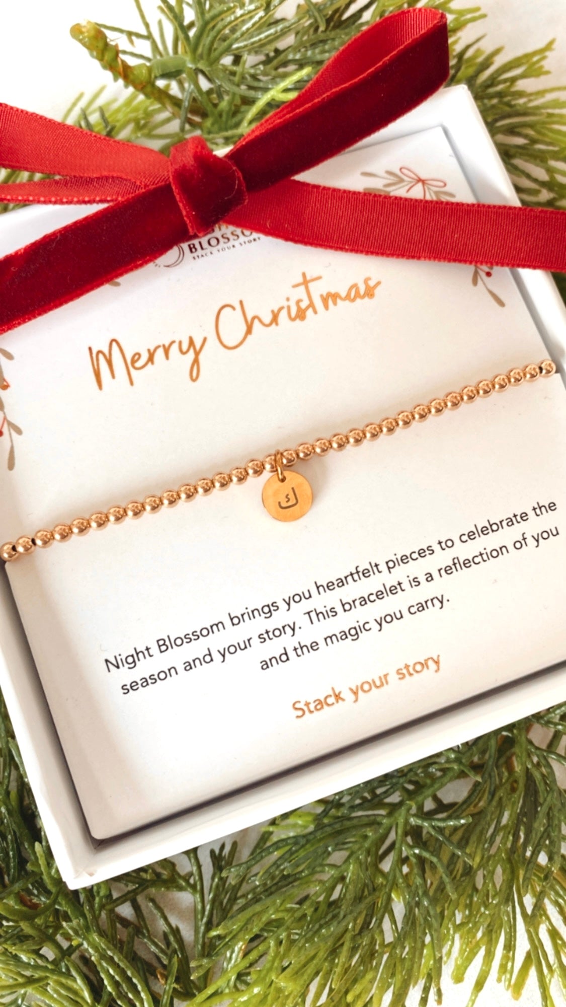 Festive gold initial charm bracelet