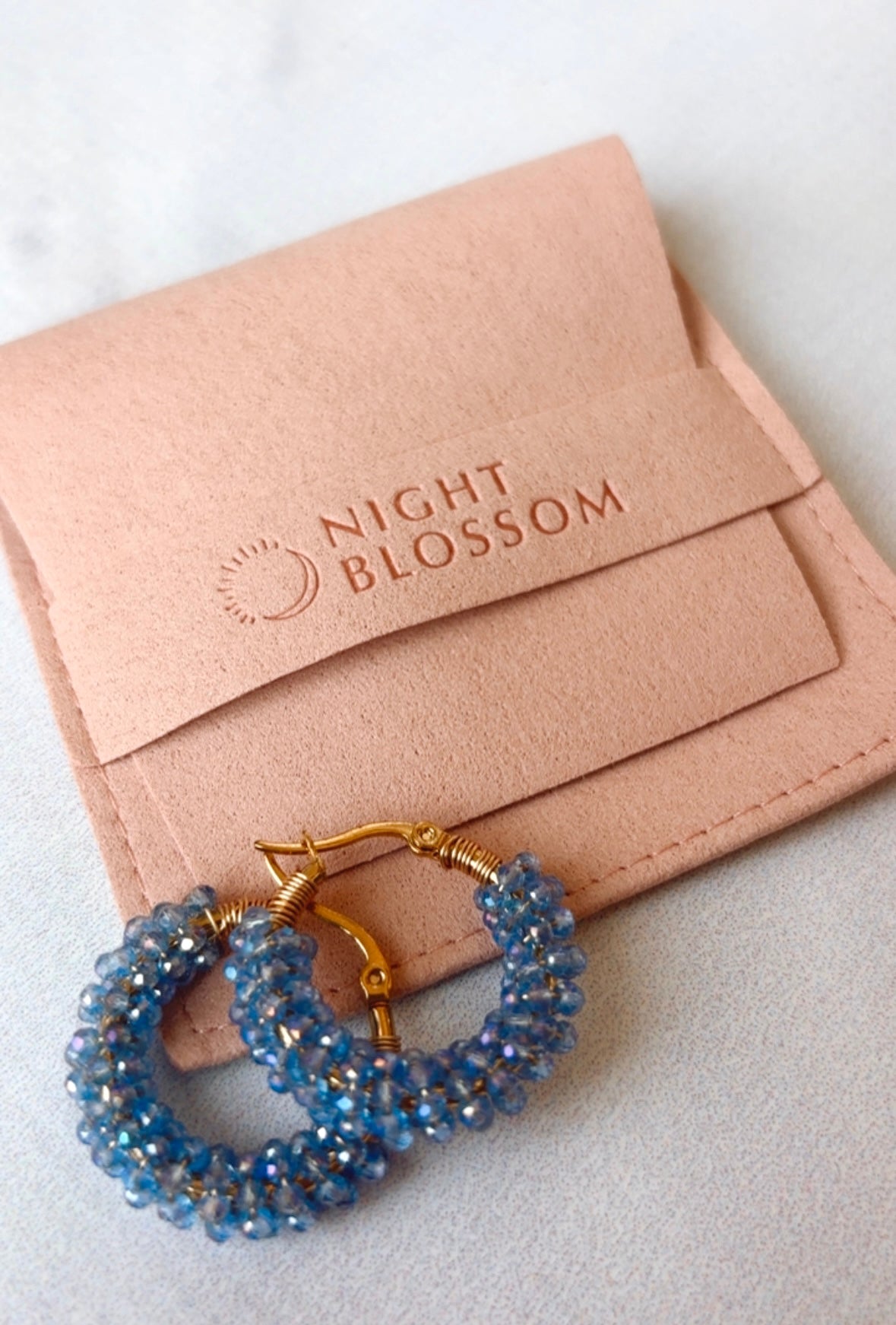 Light blue crystal hoops