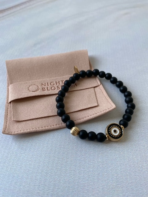 Black eye bracelet with gold accent